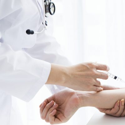 patient who receives an injection to an arm
